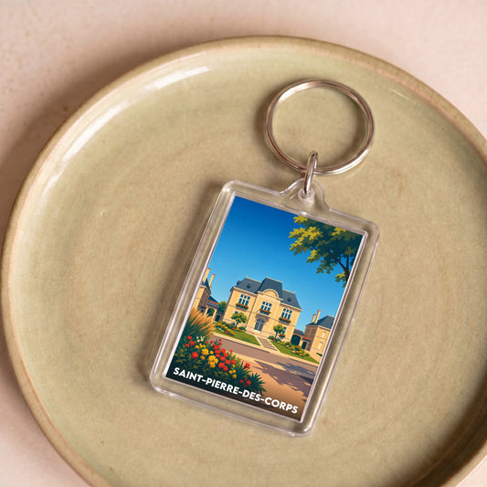 Porte-clés souvenir de la ville de Saint-Pierre-des-Corps avec une illustration stylisée.