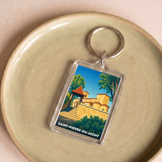 Porte-clés souvenir de la ville de Saint-Pierre-du-Mont avec une illustration stylisée.