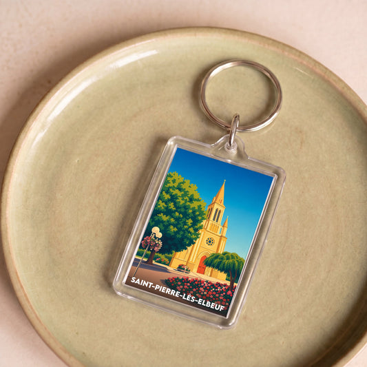 Porte-clés souvenir de la ville de Saint-Pierre-lès-Elbeuf avec une illustration stylisée de son église.