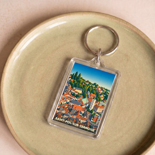 Porte-clés souvenir de la ville de Saint-Pol-sur-Ternoise avec une illustration stylisée.