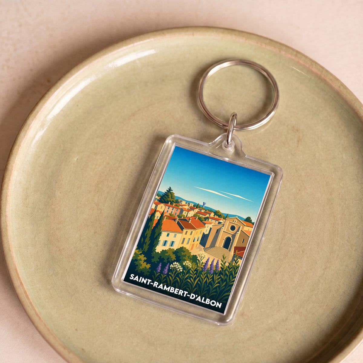 Porte-clés souvenir de la ville de Saint-Rambert-d'Albon avec une illustration stylisée.