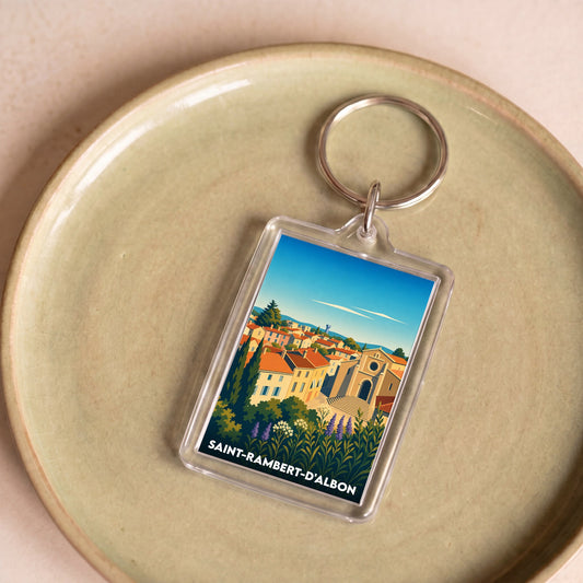 Porte-clés souvenir de la ville de Saint-Rambert-d'Albon avec une illustration stylisée.