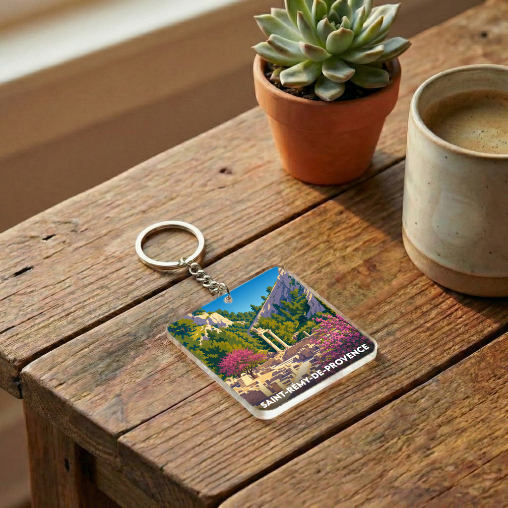 Porte-clés souvenir de la ville de Saint-Rémy-de-Provence avec une illustration colorée de Glanum.