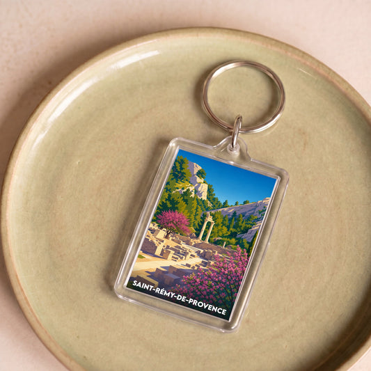 Porte-clés souvenir de la ville de Saint-Rémy-de-Provence avec une illustration colorée de Glanum.