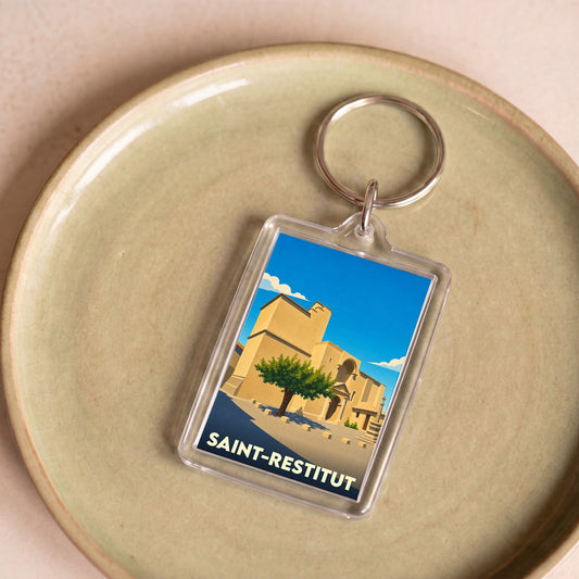 Porte-clés souvenir de la ville de Saint-Restitut avec une illustration stylisée.