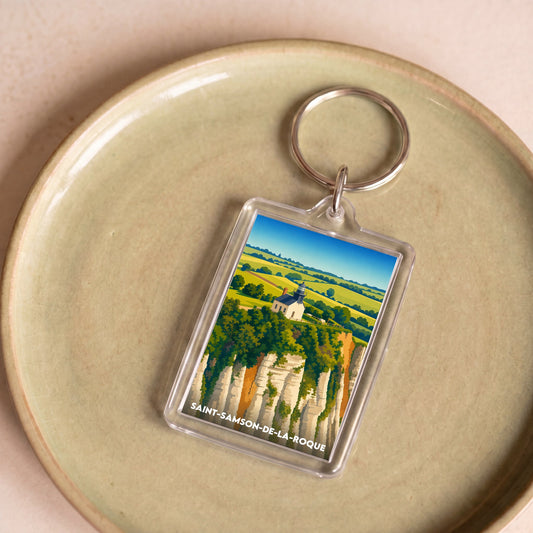 Porte-clés souvenir de la ville de Saint-Samson-de-la-Roque avec une illustration stylisée de son paysage.
