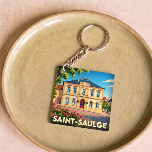 Porte-clés souvenir de la ville de Saint-Saulge avec une illustration stylisée de sa mairie.