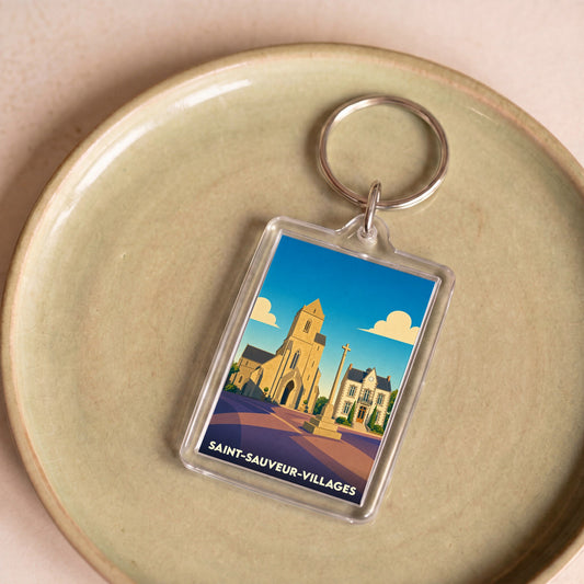 Porte-clés souvenir de la ville de Saint-Sauveur-Villages avec une illustration stylisée.