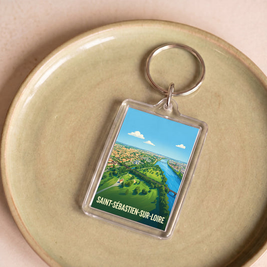Porte-clés souvenir de la ville de Saint-Sébastien-sur-Loire avec une illustration stylisée.