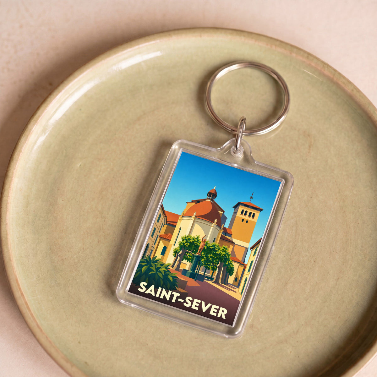 Porte-clés souvenir de la ville de Saint-Sever avec une illustration stylisée.