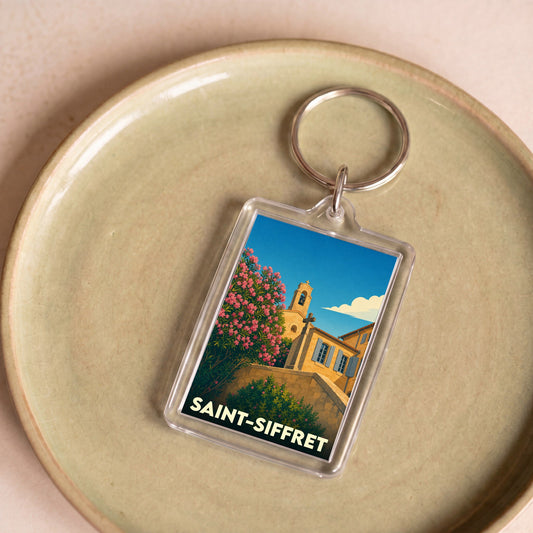 Porte-clés souvenir de la ville de Saint-Siffret avec une illustration stylisée.