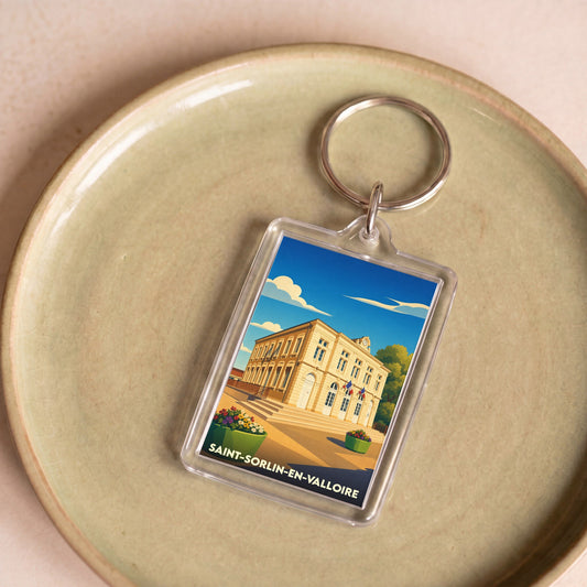Porte-clés souvenir de la ville de Saint-Sorlin-en-Valloire avec une illustration stylisée.
