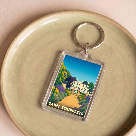 Porte-clés souvenir de la ville de Saint-Soupplets avec une illustration stylisée d'un château et de jardins.