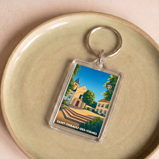 Porte-clés souvenir de la ville de Saint-Thibault-des-Vignes avec une illustration stylisée.