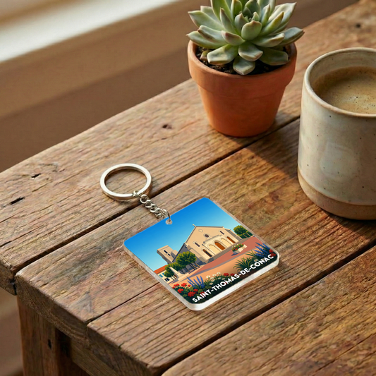 Porte-clés souvenir de la ville de Saint-Thomas-de-Conac avec une illustration stylisée.