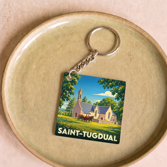 Porte-clés souvenir de Saint-Tugdual illustré d'une église et d'une calèche dans un style vintage.