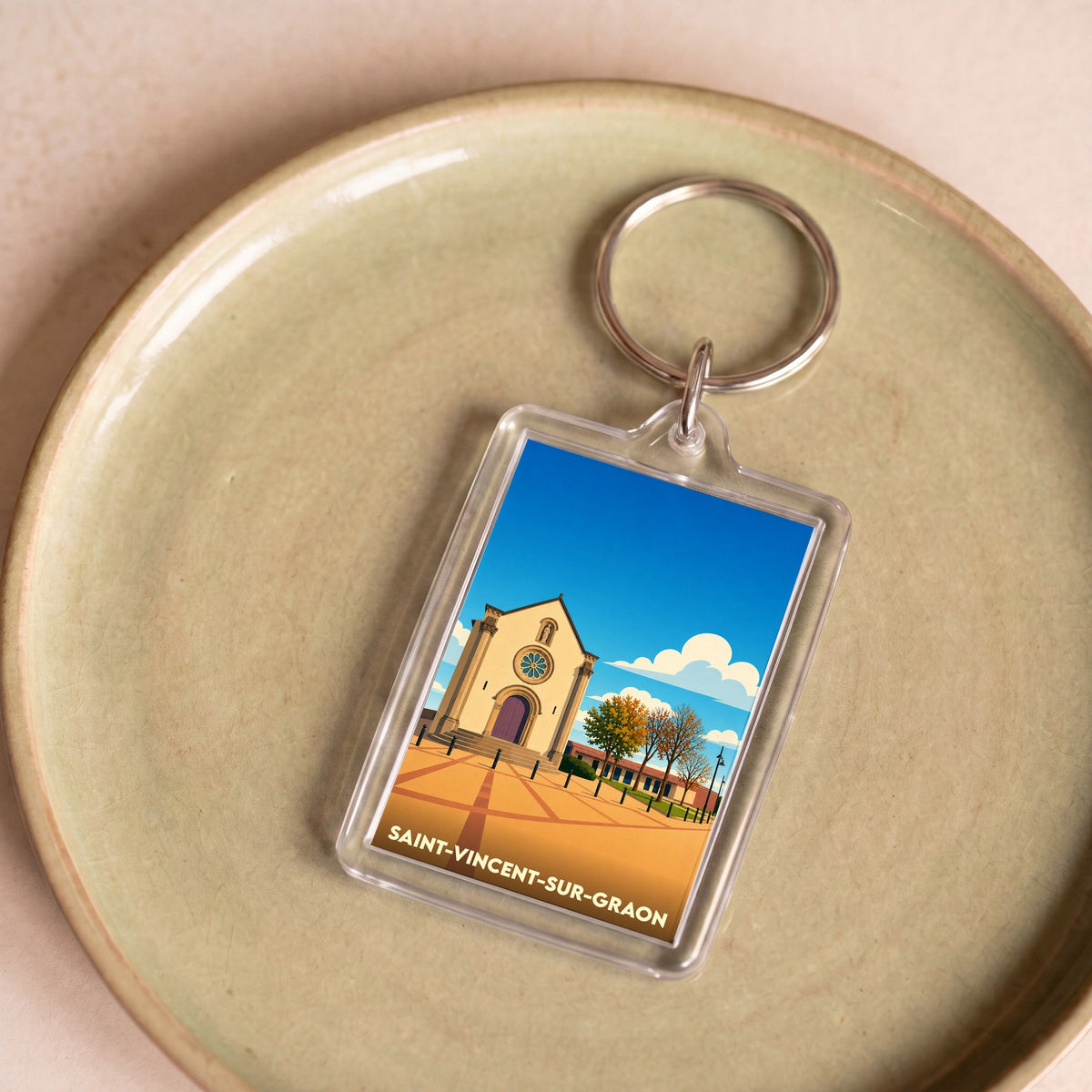 Porte-clés souvenir de la ville de Saint-Vincent-sur-Graon avec une illustration stylisée de son église.