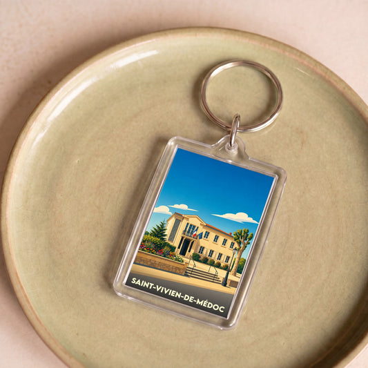 Porte-clés souvenir de la ville de Saint-Vivien-de-Médoc avec une illustration stylisée.
