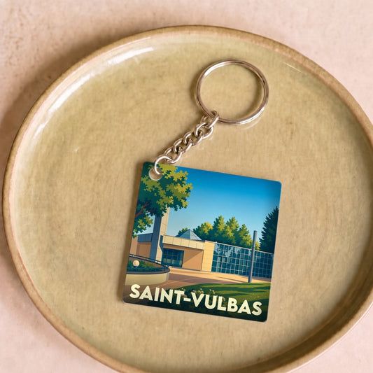 Porte-clés souvenir de la ville de Saint-Vulbas avec une illustration stylisée.