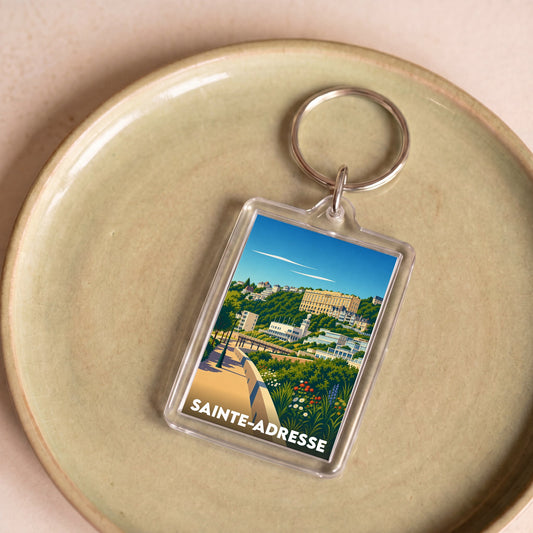 Porte-clés souvenir de la ville de Sainte-Adresse avec une illustration stylisée.
