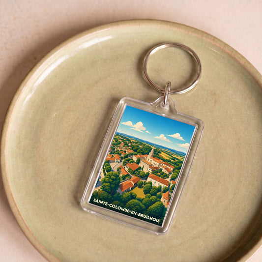 Porte-clés souvenir de la ville de Sainte-Colombe-en-Bruilhois avec une illustration stylisée.