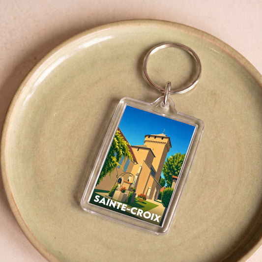 Porte-clés souvenir de la ville de Sainte-Croix avec une illustration stylisée.
