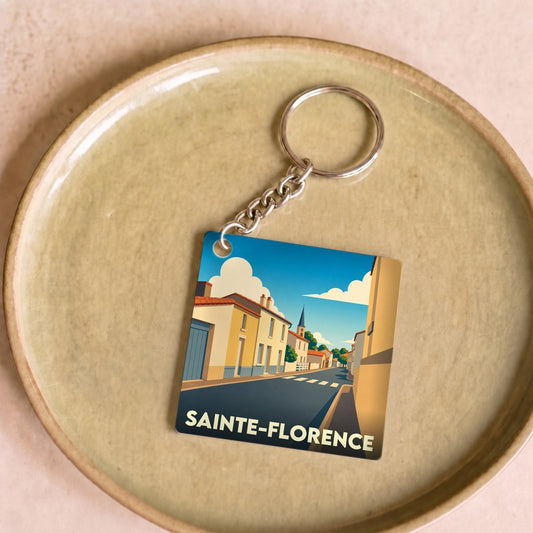 Porte-clés souvenir de la ville de Sainte-Florence avec une illustration stylisée.