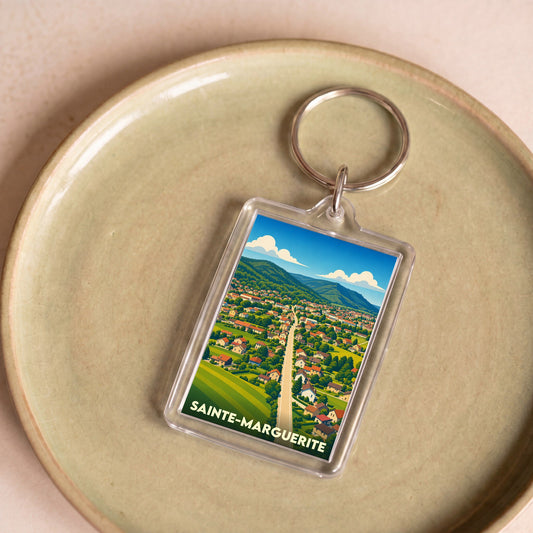 Porte-clés souvenir de la ville de Sainte-Marguerite avec une illustration stylisée.