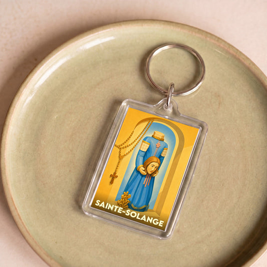 Porte-clés souvenir de la ville de Sainte-Solange illustrant la sainte patronne.