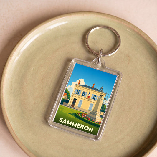 Porte-clés souvenir de la ville de Sammeron avec une illustration stylisée de la mairie.