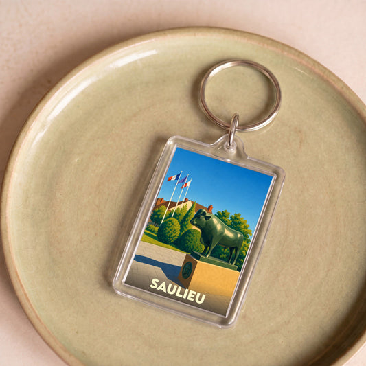 Porte-clés souvenir de la ville de Saulieu avec une illustration stylisée de sa célèbre statue de taureau.