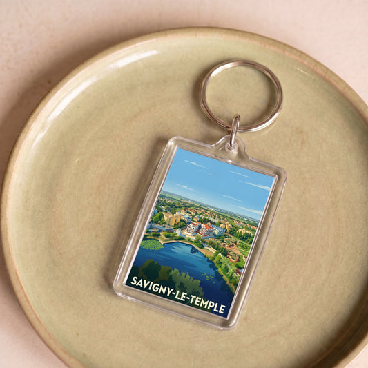 Porte-clés souvenir de la ville de Savigny-le-Temple avec une illustration stylisée.