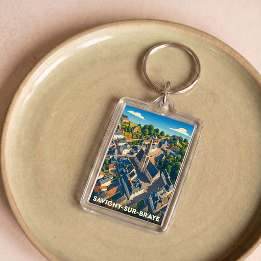 Porte-clés souvenir de la ville de Savigny-sur-Braye avec une illustration stylisée.