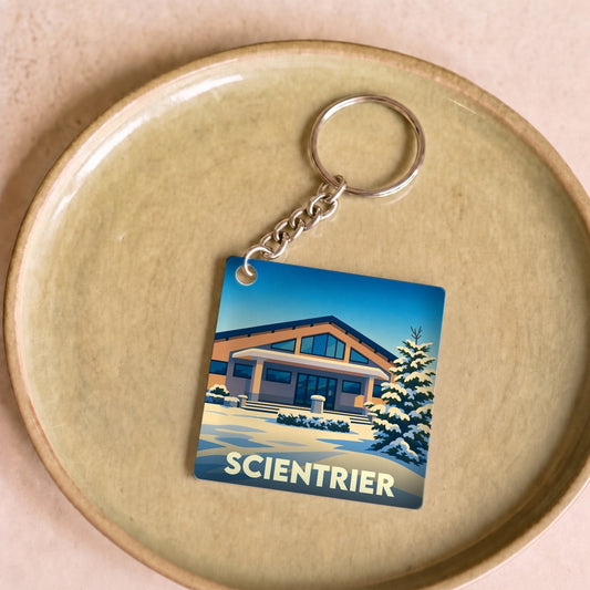 Porte-clés souvenir de la ville de Scientrier avec une illustration stylisée et enneigée.