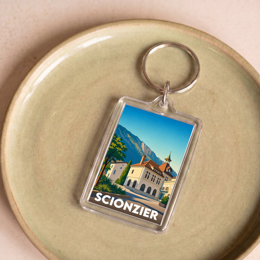 Porte-clés souvenir de la ville de Scionzier avec une illustration stylisée.