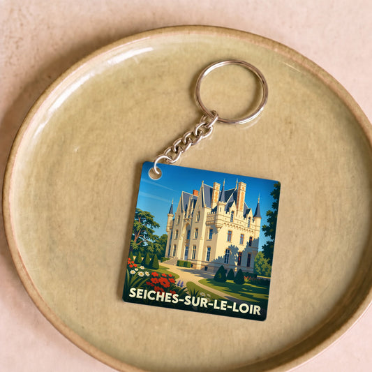 Porte-clés souvenir de la ville de Seiches-sur-le-Loir avec une illustration stylisée de château.