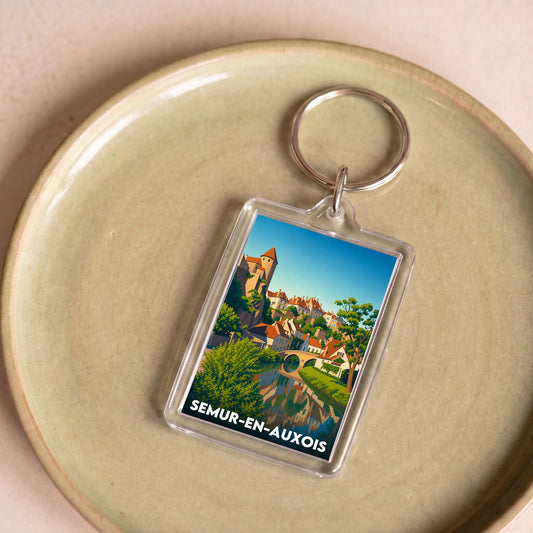 Porte-clés souvenir de la ville de Semur-en-Auxois avec une illustration stylisée.