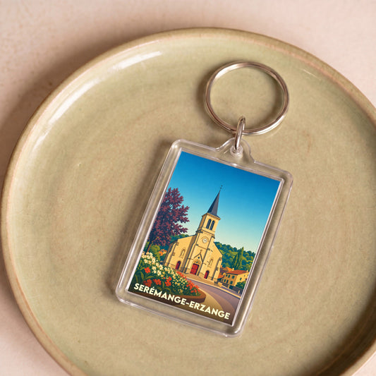 Porte-clés souvenir de la ville de Serémange-Erzange avec une illustration stylisée de son église.