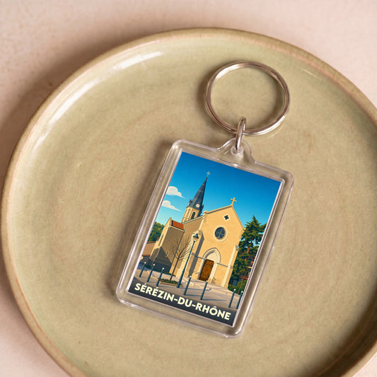 Porte-clés souvenir de la ville de Sérézin-du-Rhône avec une illustration stylisée de son église.