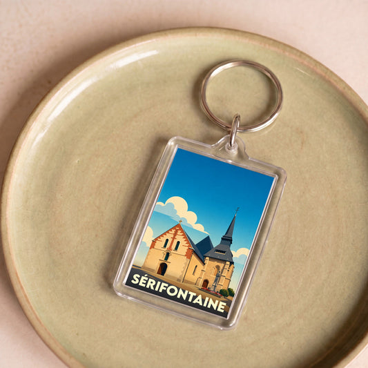 Porte-clés souvenir de la ville de Sérifontaine avec une illustration stylisée de son église.