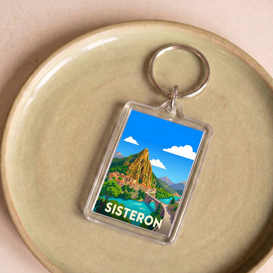 Porte-clés souvenir de la ville de Sisteron avec une illustration stylisée.