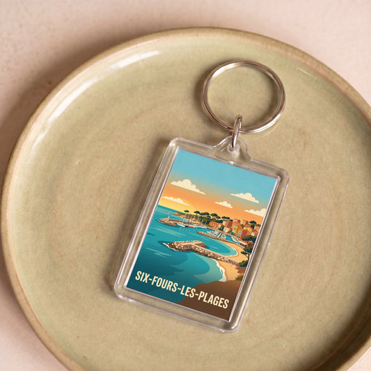 Porte-clés souvenir de la ville de Six-Fours-les-Plages avec une illustration côtière stylisée.