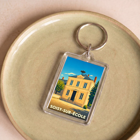 Porte-clés souvenir de la ville de Soisy-sur-École avec une illustration stylisée de sa mairie.