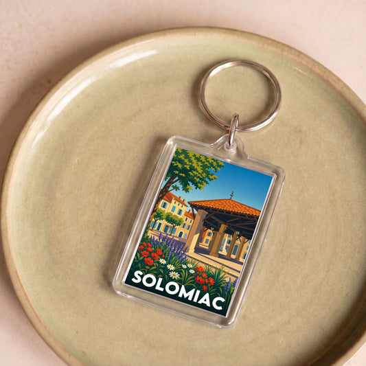 Porte-clés souvenir de la ville de Solomiac avec une illustration stylisée.