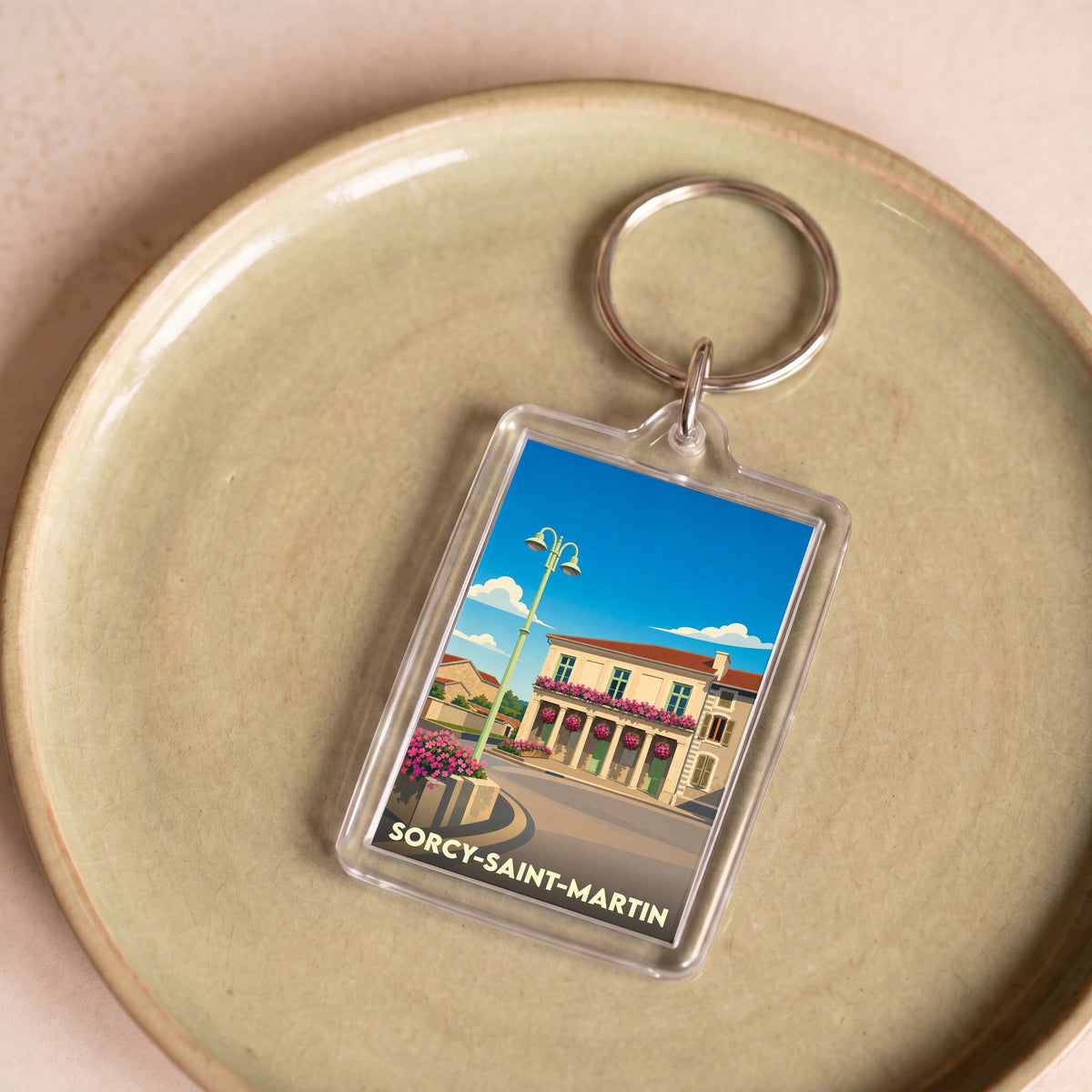 Porte-clés souvenir de la ville de Sorcy-Saint-Martin avec une illustration stylisée.