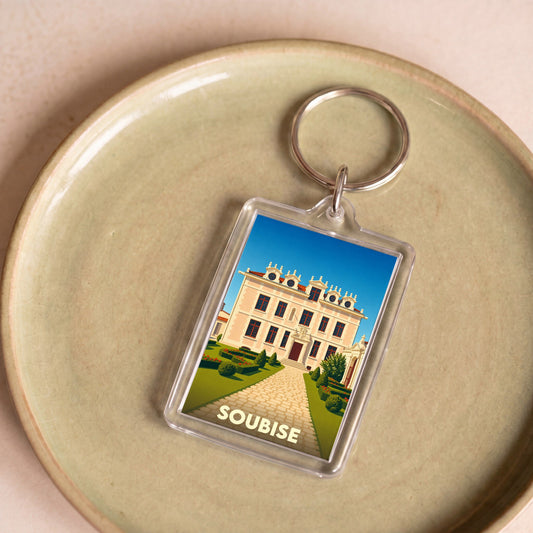 Porte-clés souvenir de la ville de Soubise avec une illustration stylisée de son patrimoine.