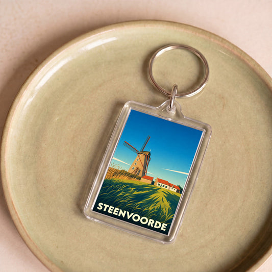 Porte-clés souvenir de la ville de Steenvoorde avec une illustration stylisée d'un moulin.