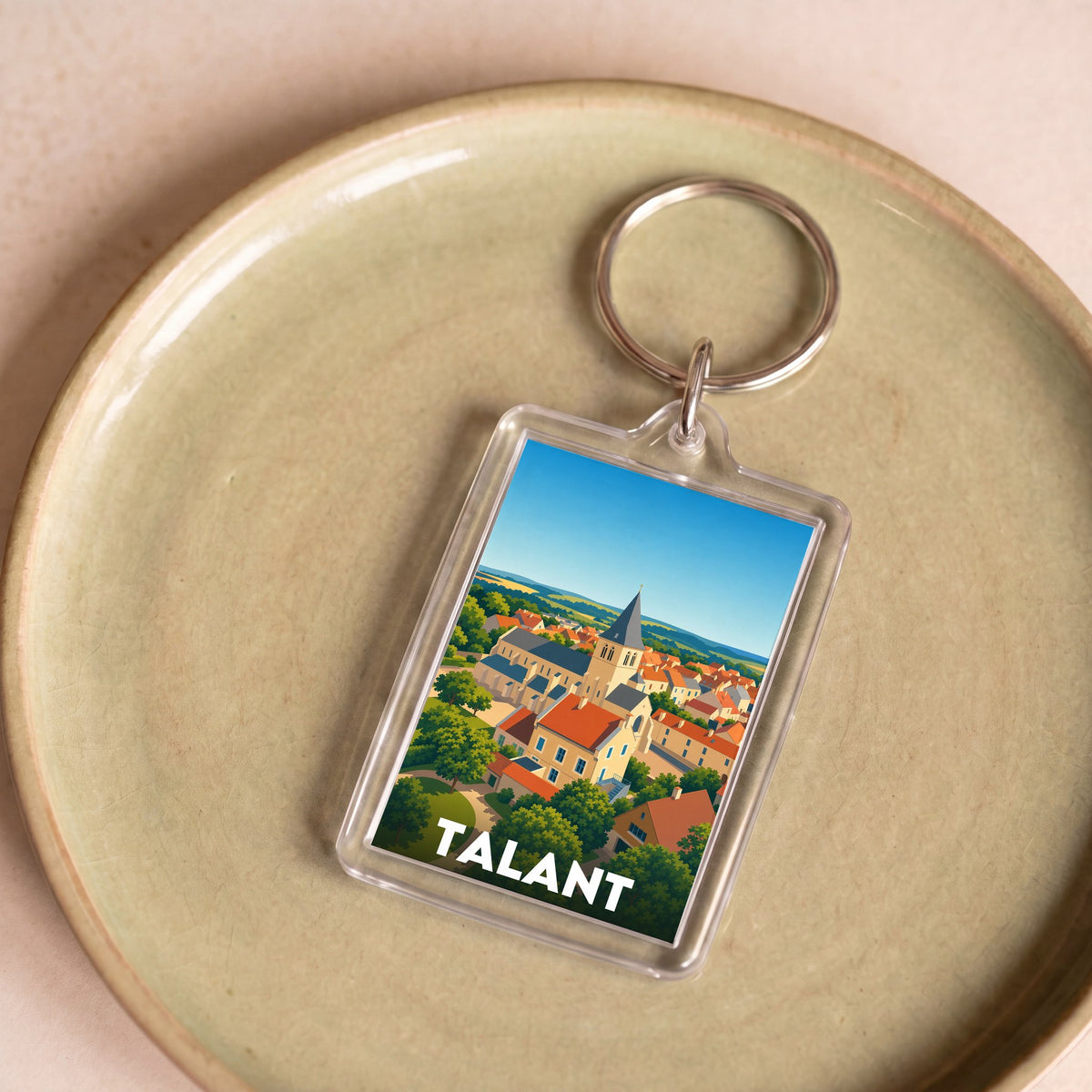Porte-clés souvenir de la ville de Talant avec une illustration stylisée.