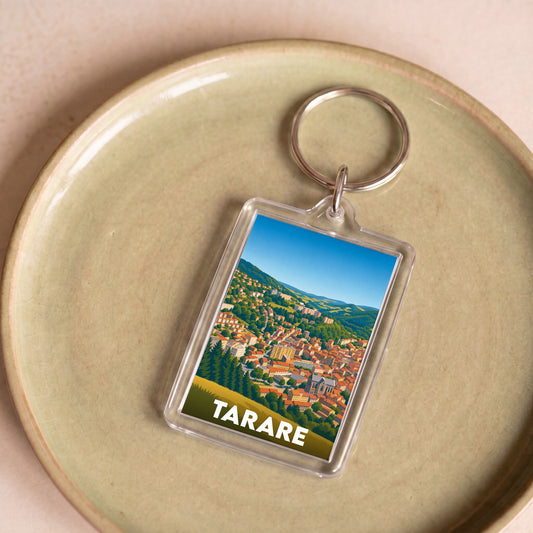 Porte-clés souvenir de la ville de Tarare avec une illustration stylisée.