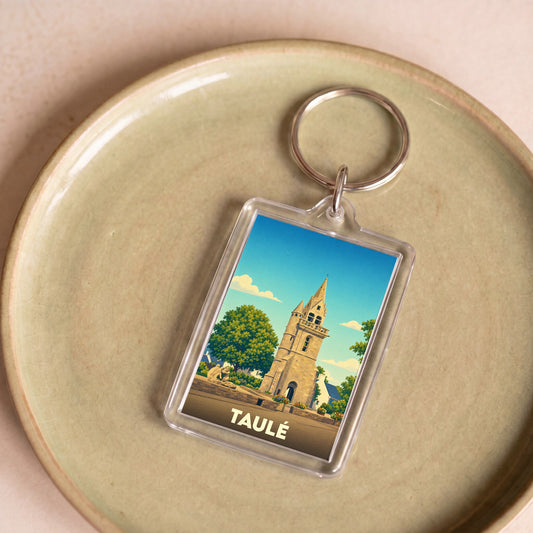 Porte-clés souvenir de la ville de Taulé avec une illustration stylisée de son clocher.